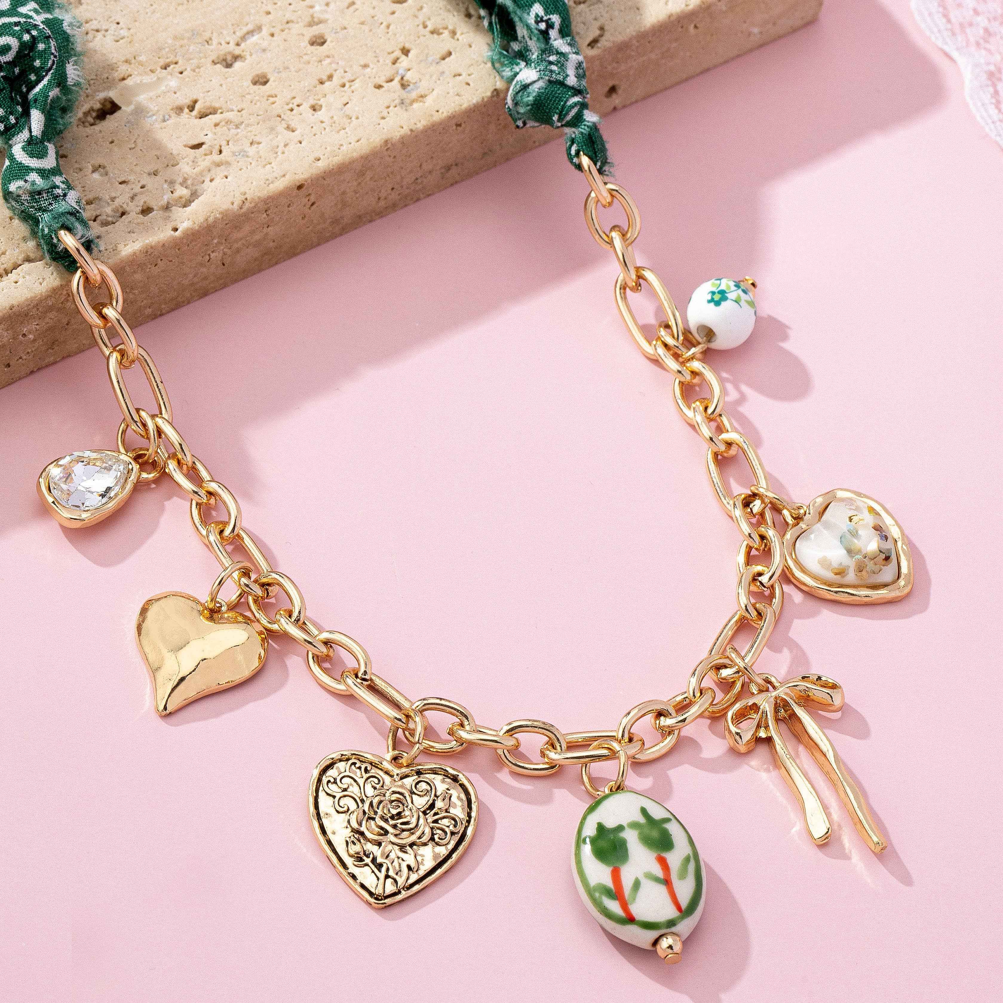 SCARF CHARM NECKLACE-PORCELAIN HEART BOW | 80N92717