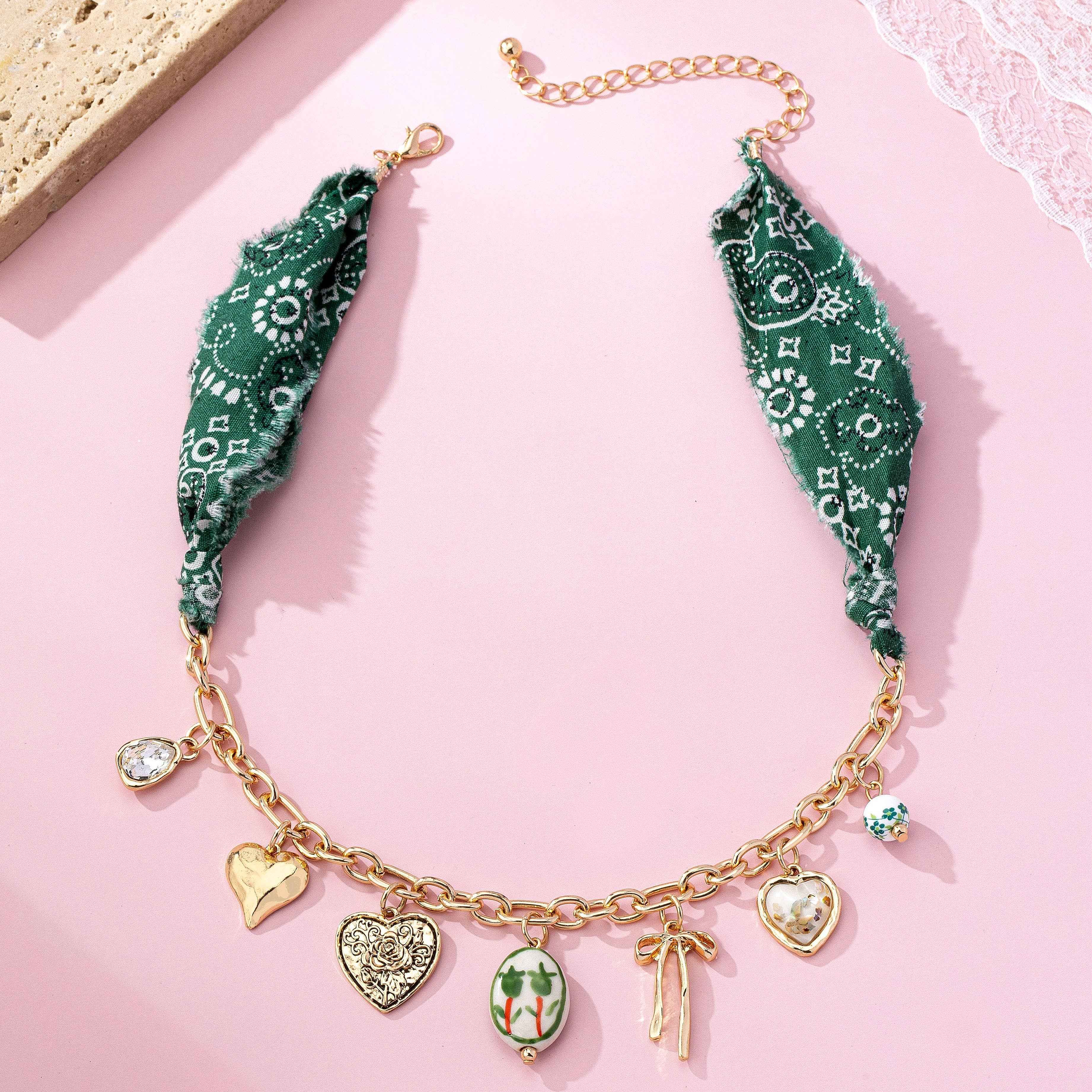 SCARF CHARM NECKLACE-PORCELAIN HEART BOW | 80N92717